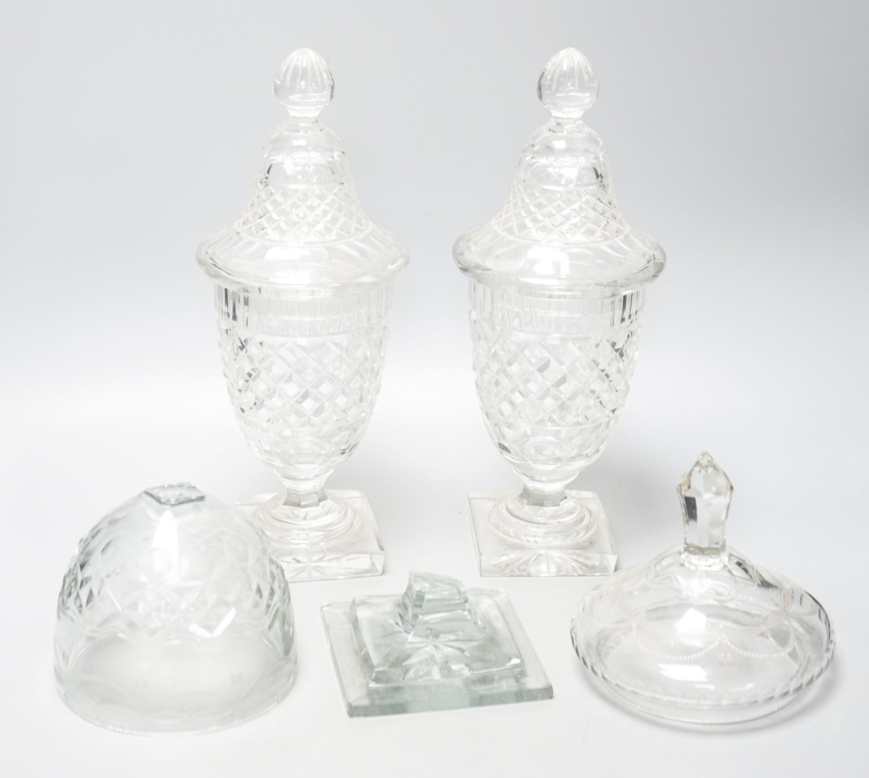 A pair of 19th/20th century cut glass sweetmeat jars and covers, H 33cm, and another (a.f.)